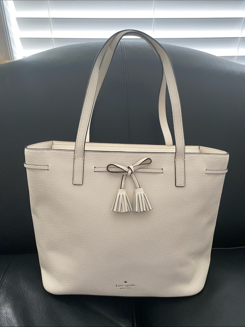 kate spade Cream Pebbled Leather Tote with Tassel Bow